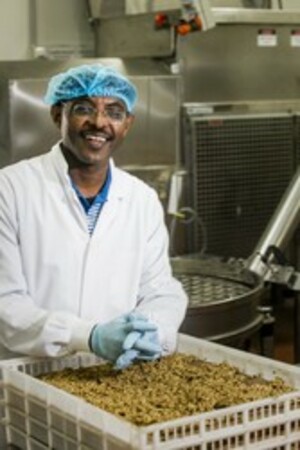 A man working in a food processing facility