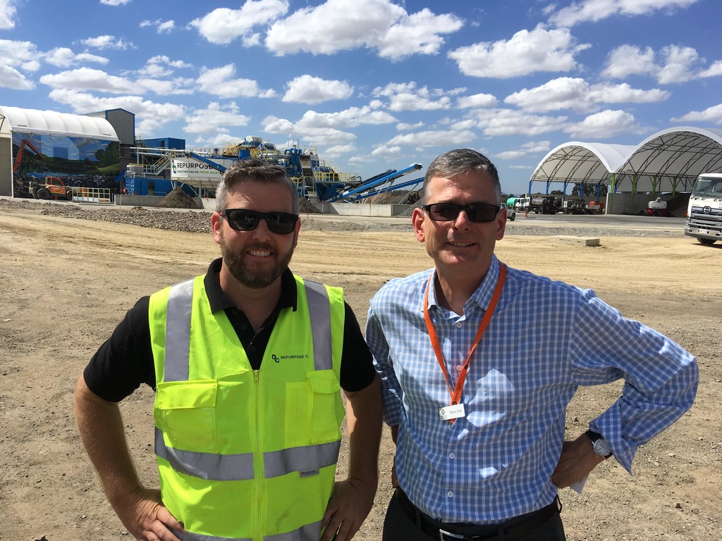 Jeffrey Canada, Repurpose It sales and materials supervisor with Brotherhood employer engagement coordinator Simon Gray standing at a rubbish tip